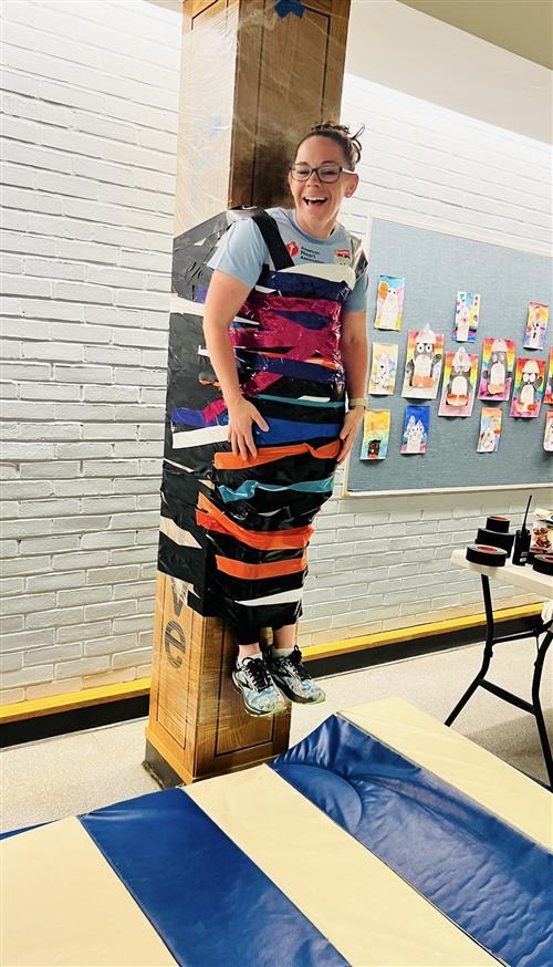 kim taped to pillar